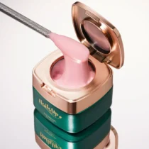 Tarro abierto de gel NAILSUP Supreme 021 de 50 g con una espátula mostrando su textura rosa.