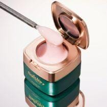 Tarro abierto de gel de construcción NAILSUP Supreme 020 de 50 g, con gel rosa claro sobre una espátula.